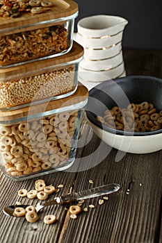 Breakfast cereal. Glass boxes with granola, cereal rings and Quinoa pops. Cereal Loops in a Bowl. Healthy Ready-to-eat breakfast