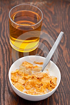 Breakfast cereal with milk and apple juice