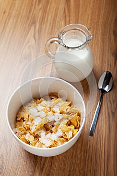 Breakfast cereal with milk and spoon