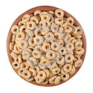 Breakfast cereal rings in a wooden bowl on a white