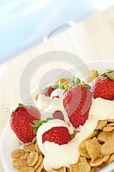 Breakfast cereal with strawberries and cream