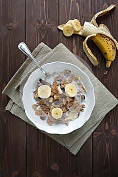 Breakfast cereals with milk and banana