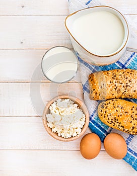 Breakfast of cheese, milk, bread and eggs