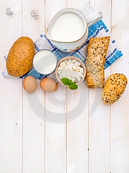 Breakfast of cheese, milk, bread and eggs