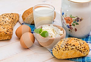 Breakfast of cheese, milk, bread and eggs