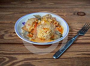 Breakfast with chicken meatballs with rice and vegetables on a light plate