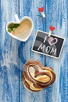 Breakfast with coffee and bun Heart. Letter I love mom