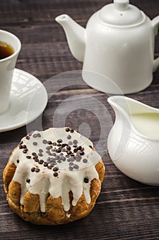 Breakfast: coffee with cake and milk/breakfast: coffee with cake and milk on a dark wooden background