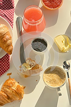 Breakfast With Coffee, And Croissant on White Table