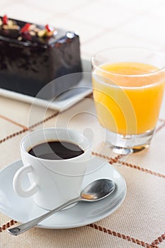 Breakfast with coffee, orange juice and plumcake