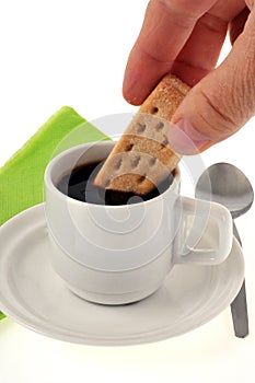 Dipping a shortbread in a cup of coffee