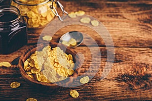 Breakfast with corn flakes, milk and jam