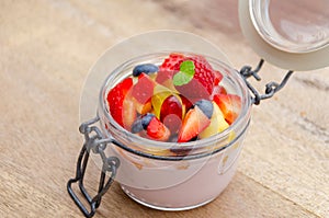 Breakfast with creamy yogurt and fresh fruit in a jar