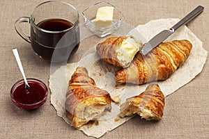 Breakfast. Croissant with butter