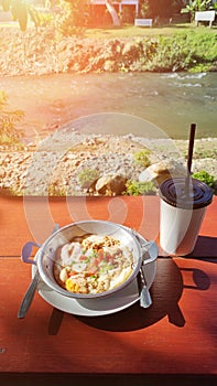 Breakfast egg pan and cup of water