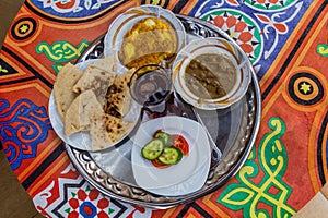 Breakfast in Egypt - fuul, bread, salad, omelette and t