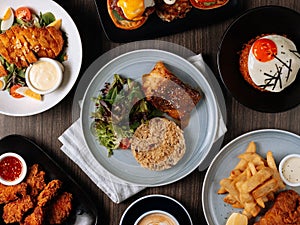 A breakfast fast food table Pan Fried Wild Cod Fish, Kimchi Fried Rice, Wing Zing, Fish And Chips, Caramel Latte, Eggs Blackstone