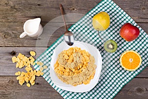 Breakfast: flakes in a plate, milk in a jug