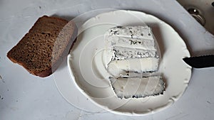breakfast food, white cheese on a plate, fresh coffee,black bread