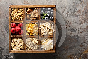 Breakfast foods in a wooden box overhead shot