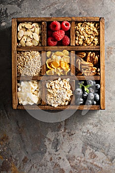 Breakfast foods in a wooden box overhead shot
