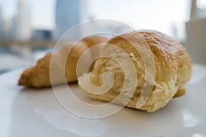 Breakfast with fresh croissants, close up, selective focus