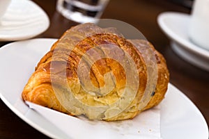 Breakfast with fresh croissants , a close up shot