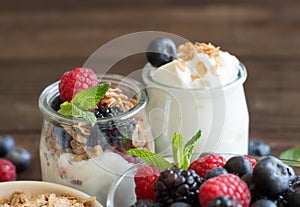 Breakfast with Fresh greek yogurt, muesli and berries