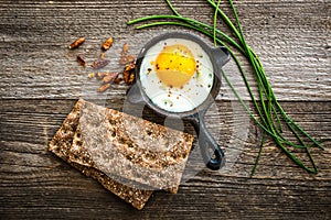 Breakfast with fried egg and bread