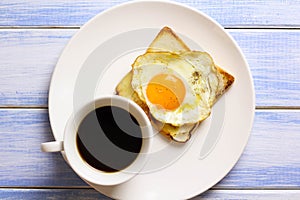 Breakfast fried egg and bread placed on the table