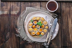 Breakfast with fried mini eggs and breadm copy space