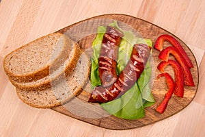 Breakfast with fried sausage, paprika and bread