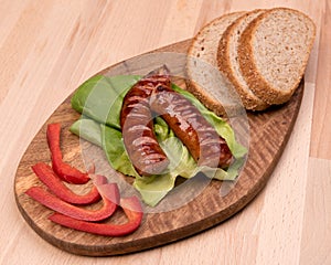 Breakfast with fried sausage, paprika and bread