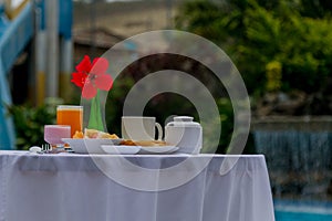 Breakfast in front of the pool photo