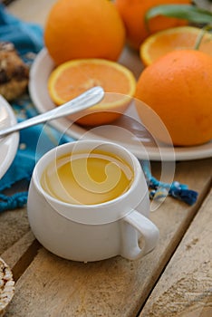 Breakfast, fruit, corn flakes, milk and orange juice on the wooden table