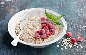 Breakfast gluten free oatmeal porridge with raspberries