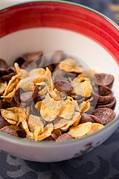 Breakfast golden and chocolate cornflakes cereal bowl