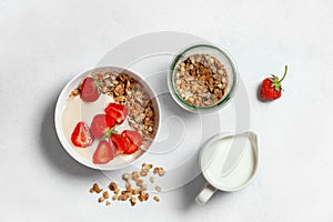 Breakfast with granola and strawberries