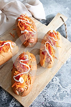 Homemade hot dogs with sausage and carrot