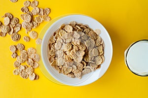 Breakfast ingredients. Cereals with milk. Top view, A bowl of corn flakes and raisins