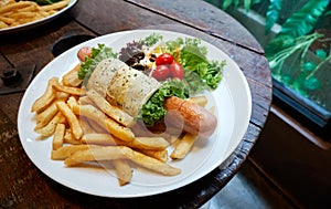 Jumbo sausage wrap with egg, fries, tomato and vegetable