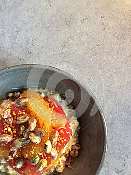 Breakfast: Kefir muesli with grapefruit, orange segments, pistachios, bee pollen