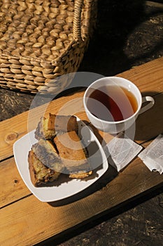Breakfast menu tea and  cake on wooden board