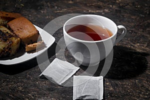 Breakfast menu tea and  cake on wooden table