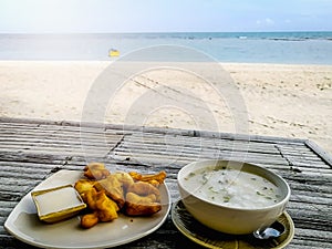 Breakfast on the morning beach table and sunrise