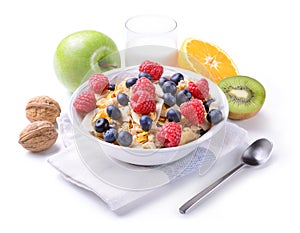 Breakfast with muesli and fruit on white background