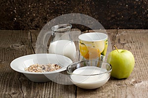 Breakfast with muesli, milk and apple