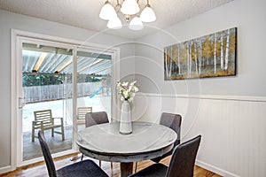 Breakfast nook with round white washed table