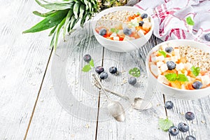 Breakfast oatmeal with tropical fruits