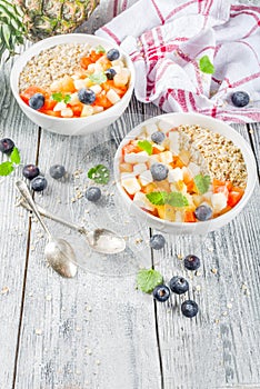 Breakfast oatmeal with tropical fruits